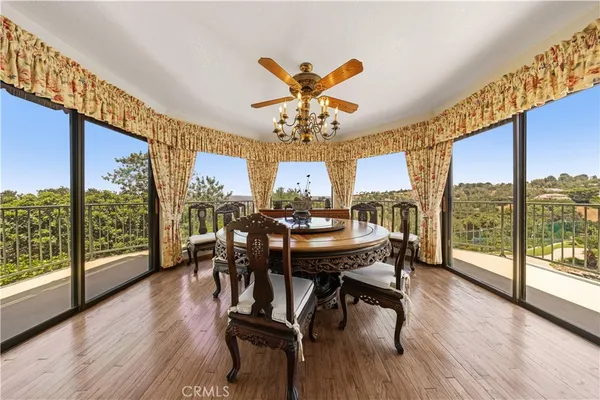 a living room with furniture and large windows