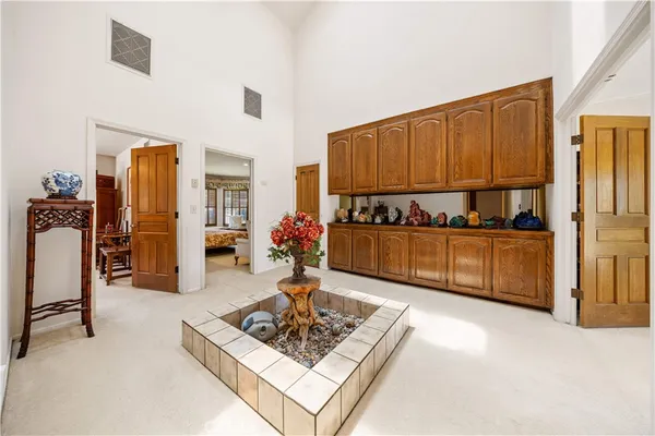 a spacious bedroom with a bed and a couch