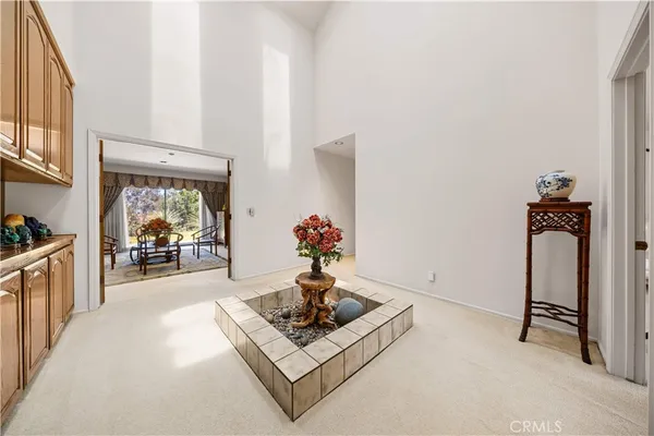 a bedroom with a bed chair and window