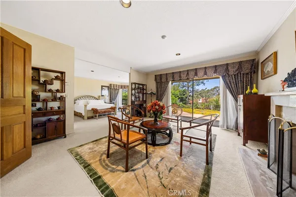 a living room with stainless steel appliances couch furniture and a table