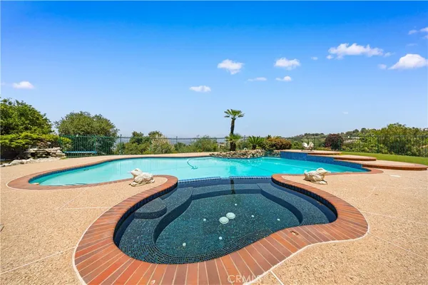an aerial view of a house with a yard and garden