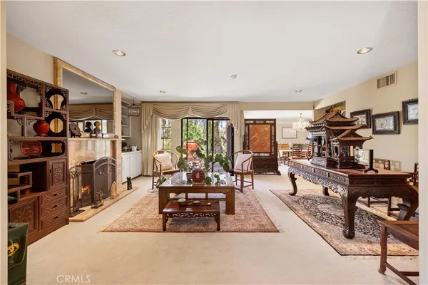 a view of a livingroom with furniture and a flat screen tv