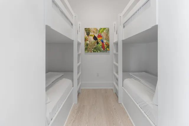 a bathroom with a toilet sink vanity and shower