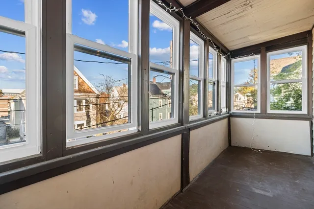 a view of an empty room with a large window