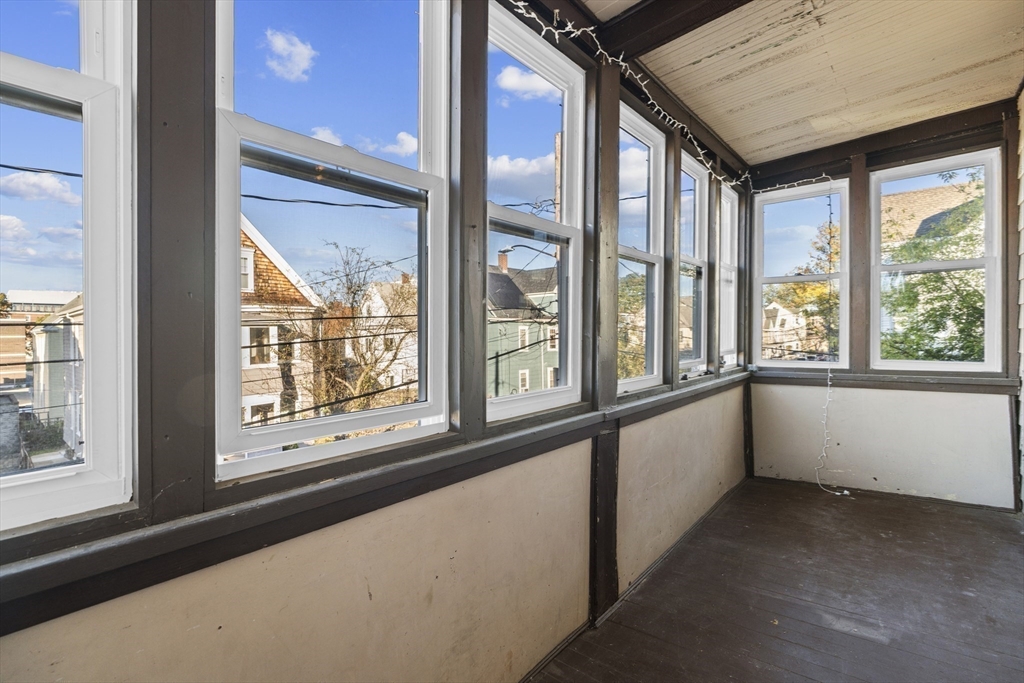 15-17 Cushman Road Boston, MA 02135 - Photo 11 of 27 a view of an empty room with a large window