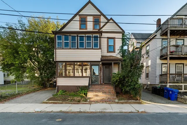 a front view of a house with a yard