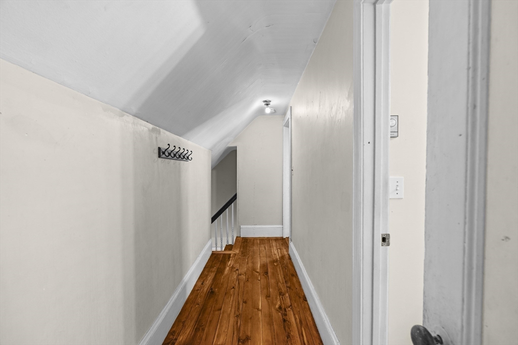 15-17 Cushman Road Boston, MA 02135 - Photo 7 of 27 a view of a hallway with wooden floor