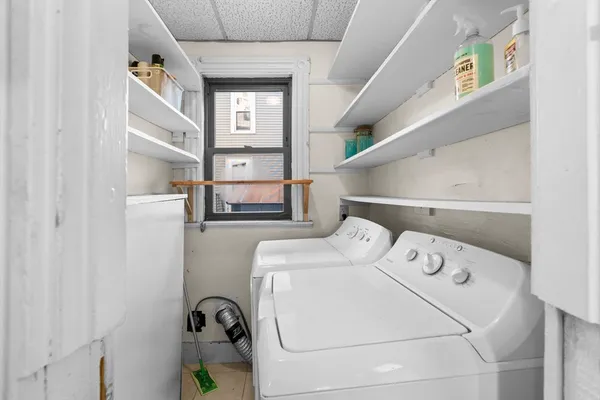 a utility room with dryer and washer