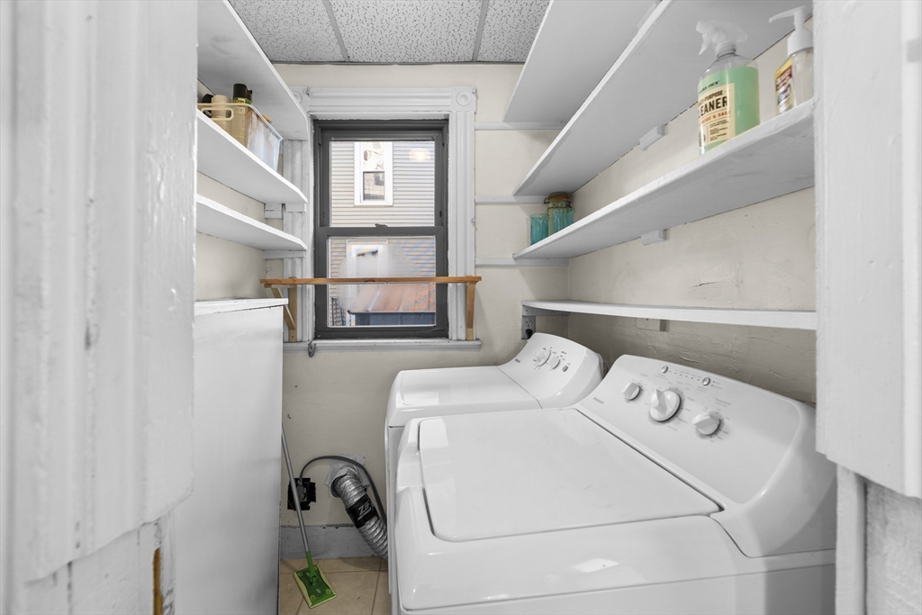 15-17 Cushman Road Boston, MA 02135 - Photo 9 of 27 a utility room with dryer and washer