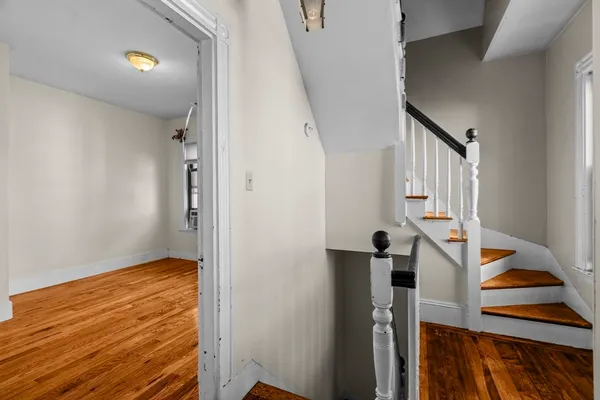 a view of entryway with wooden floor
