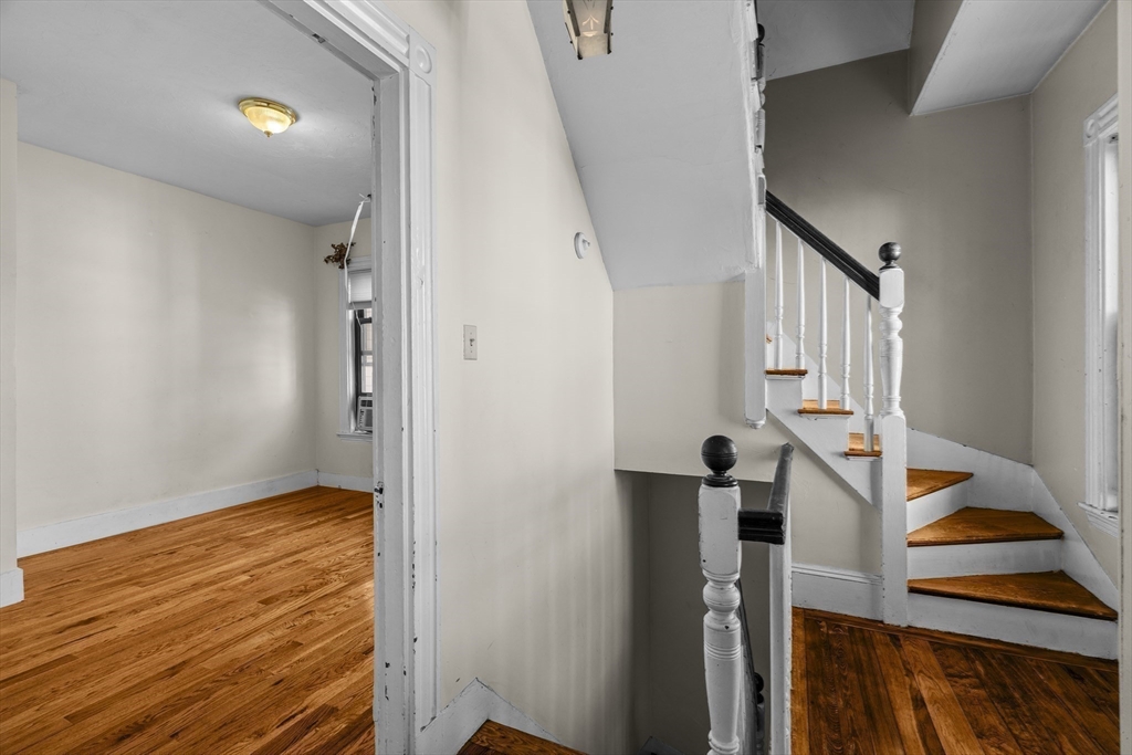 15-17 Cushman Road Boston, MA 02135 - Photo 10 of 27 a view of entryway with wooden floor