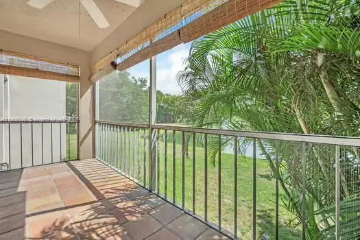 a balcony with trees in front of it