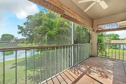 a balcony with trees in front of it