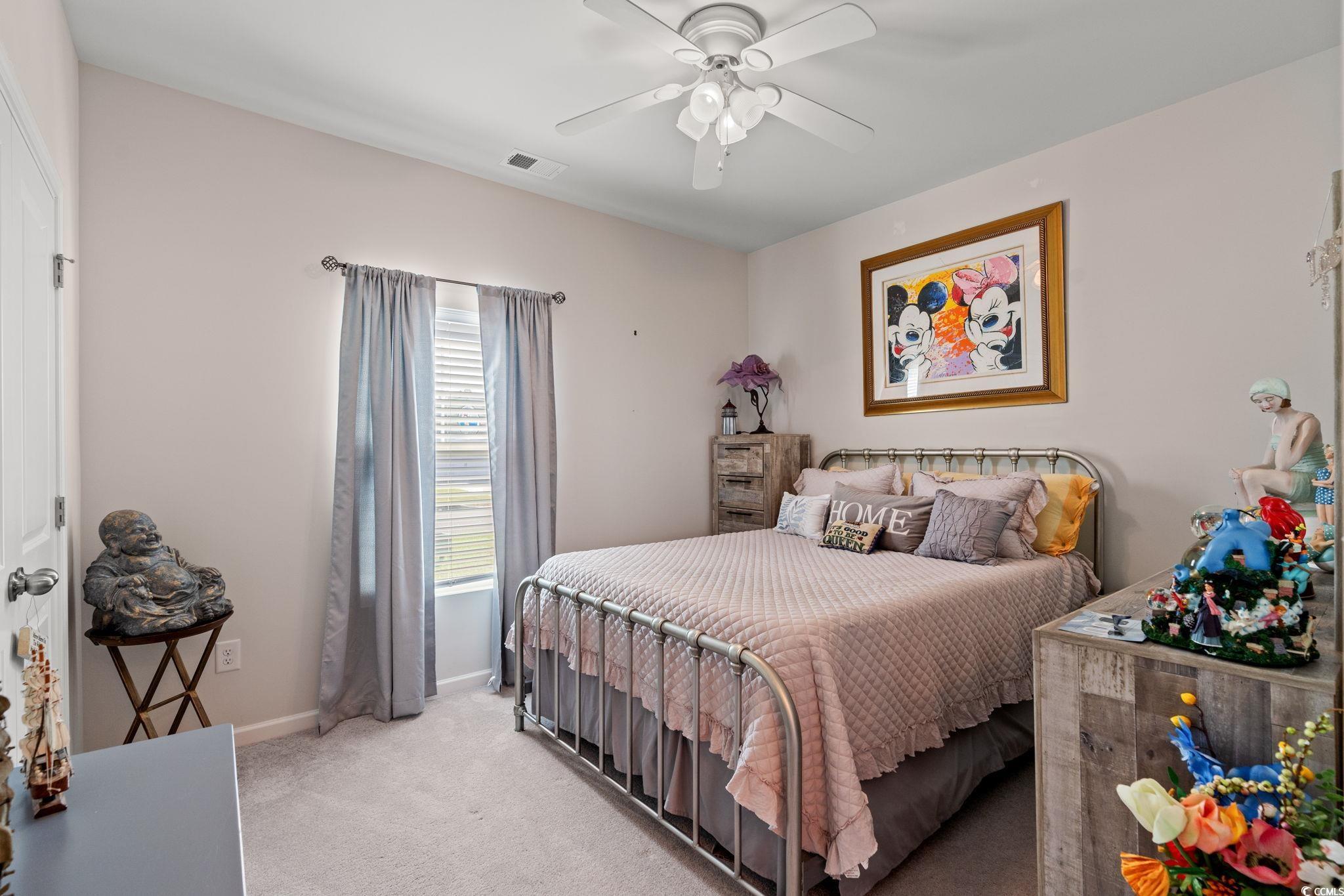 155 Marsh Deer Place Surfside Beach, SC 29575 - Photo 15 of 35 Bedroom with visible vents, baseboards, a ceiling fan, and light colored carpet