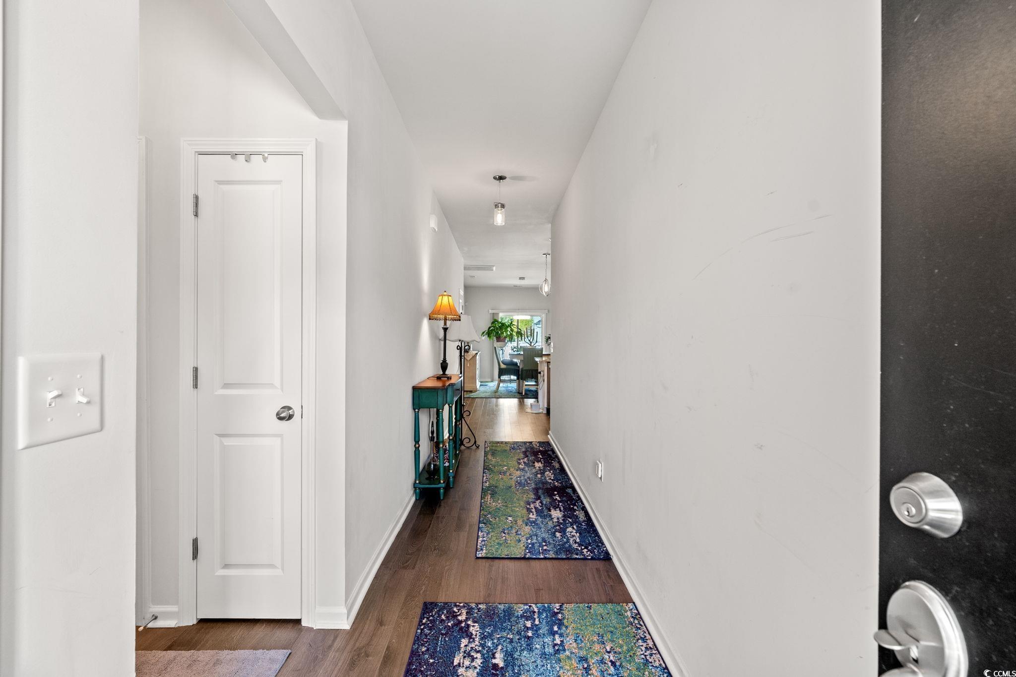 155 Marsh Deer Place Surfside Beach, SC 29575 - Photo 3 of 35 Hall with baseboards and wood finished floors
