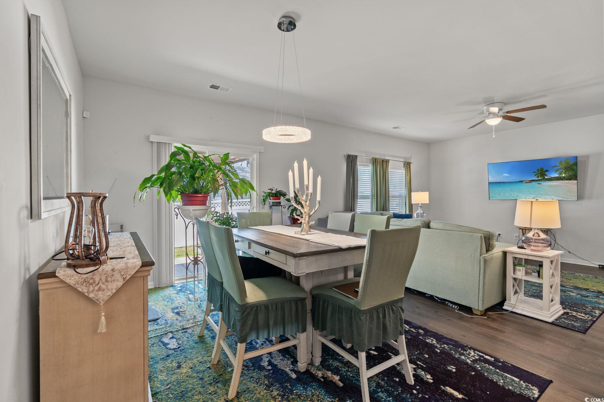 155 Marsh Deer Place Surfside Beach, SC 29575 - Photo 7 of 35 Dining room with visible vents, ceiling fan, and wood finished floors