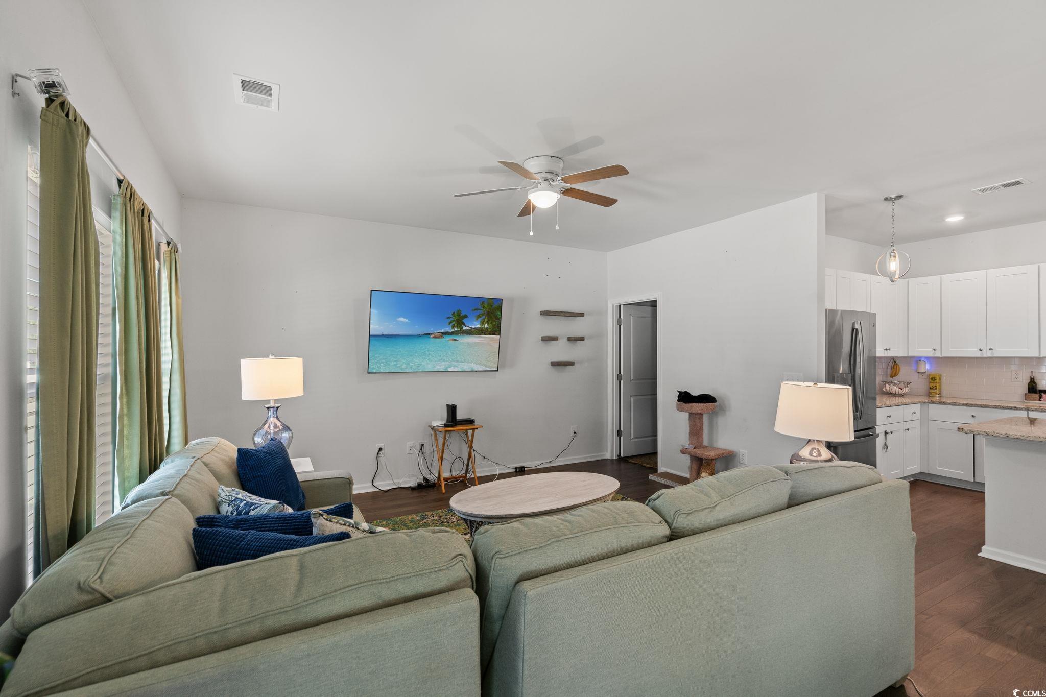 155 Marsh Deer Place Surfside Beach, SC 29575 - Photo 9 of 35 Living area with dark wood-style flooring, baseboards, visible vents, and ceiling fan