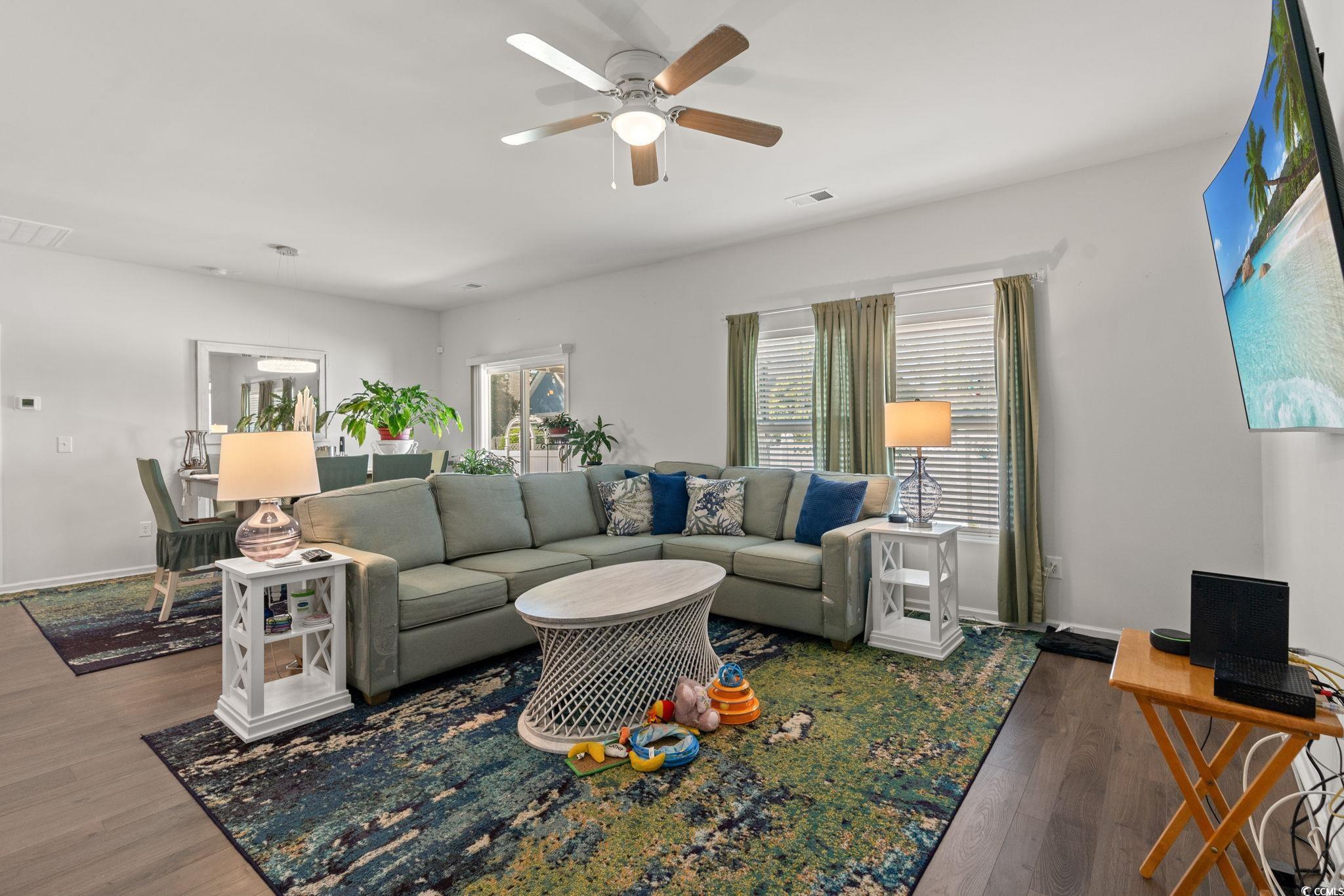 155 Marsh Deer Place Surfside Beach, SC 29575 - Photo 10 of 35 Living area with wood finished floors, ceiling fan, and visible vents