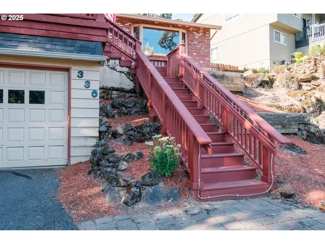 a view of a house with a small yard