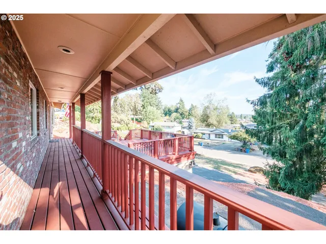 a view of balcony with wooden floor