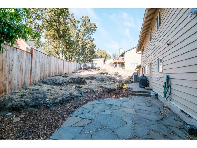 a view of a backyard of the house