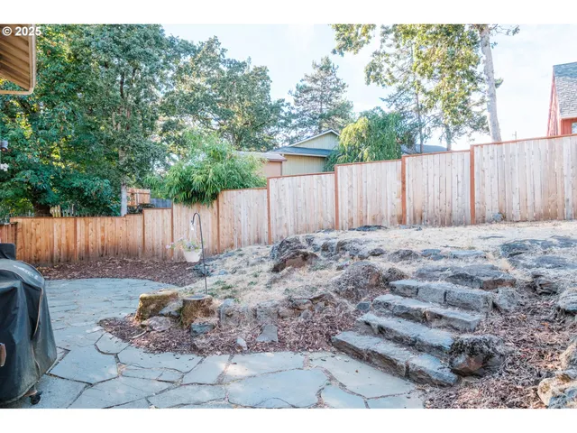a view of outdoor space with wooden fence