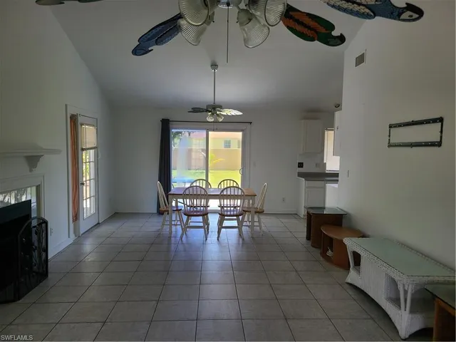 a view of a livingroom with furniture and a ceiling fan