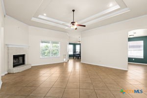 4207 Mildred Avenue Killeen, TX 76549 - Photo 3 of 15 a view of an empty room with a fireplace and a window