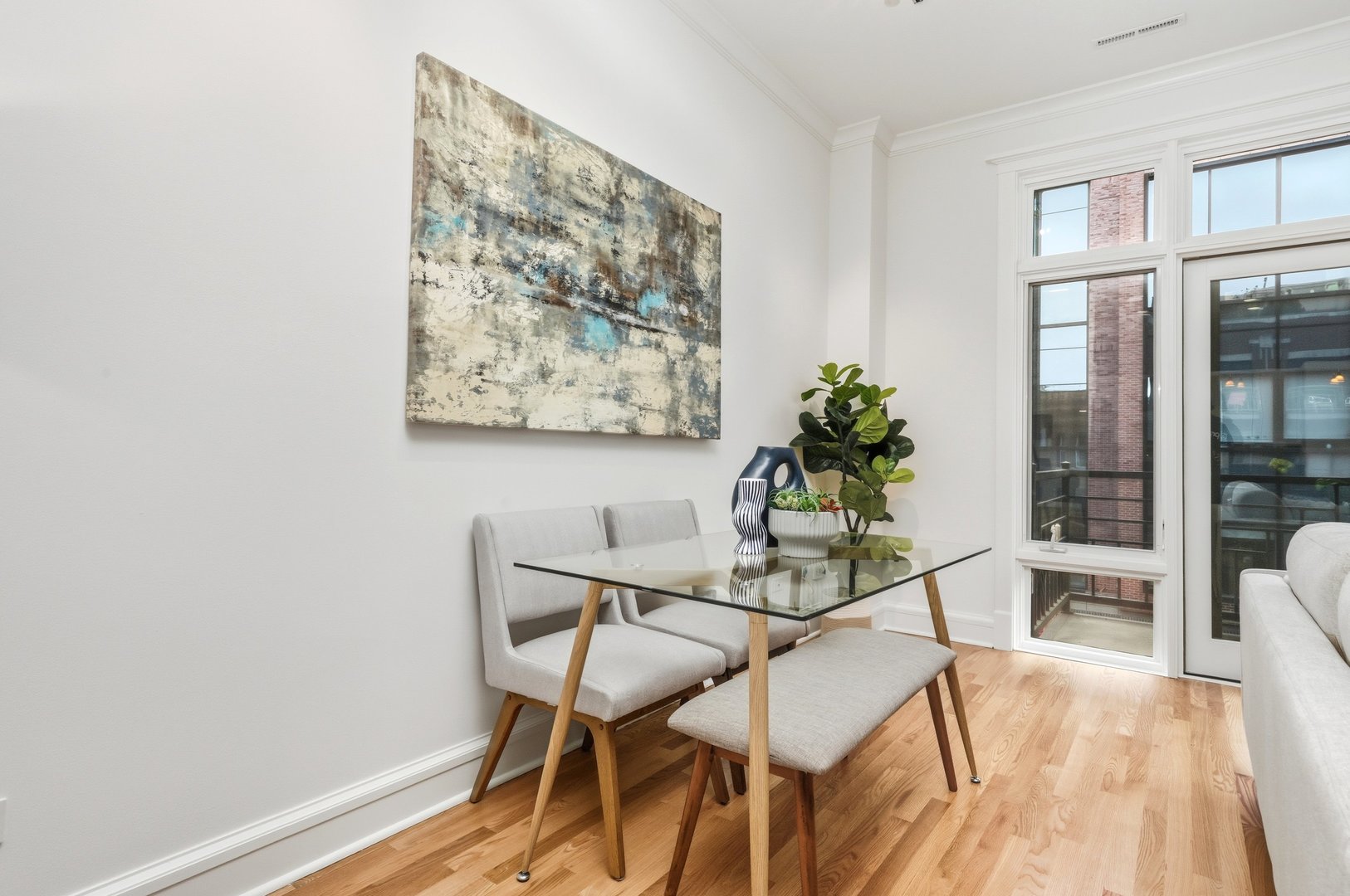 800 West Cornelia Avenue, Unit 307 Chicago, IL 60657 - Photo 14 of 22 a dining room with furniture and wooden floor
