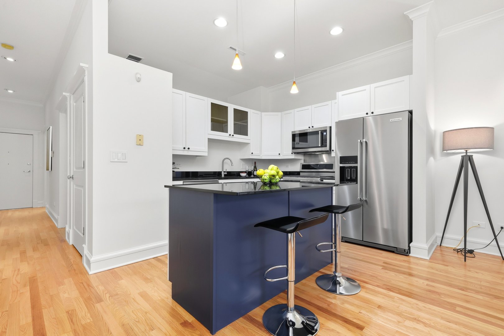 800 West Cornelia Avenue, Unit 307 Chicago, IL 60657 - Photo 18 of 22 a kitchen with a refrigerator a stove top oven a sink and dishwasher