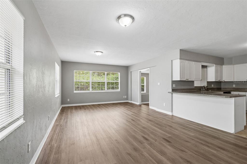 9931 110th Street Seminole, FL 33772 - Photo 19 of 52 a view of a kitchen with wooden floor and a window