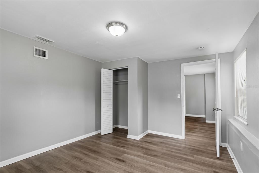 9931 110th Street Seminole, FL 33772 - Photo 28 of 52 a view of an empty room with wooden floor