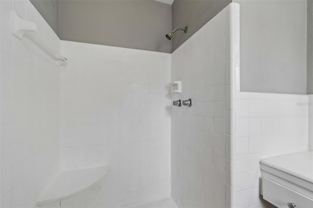 9931 110th Street Seminole, FL 33772 - Photo 34 of 52 a bathroom with a shower