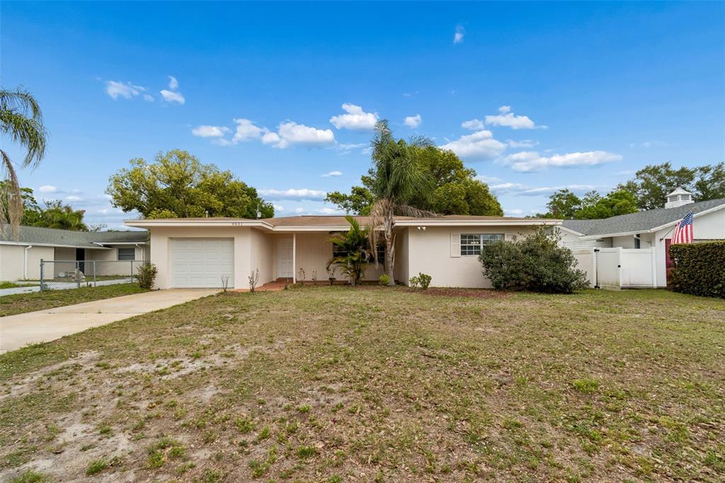 9931 110th Street Seminole, FL 33772 - Photo 4 of 52 front view of a house with a street