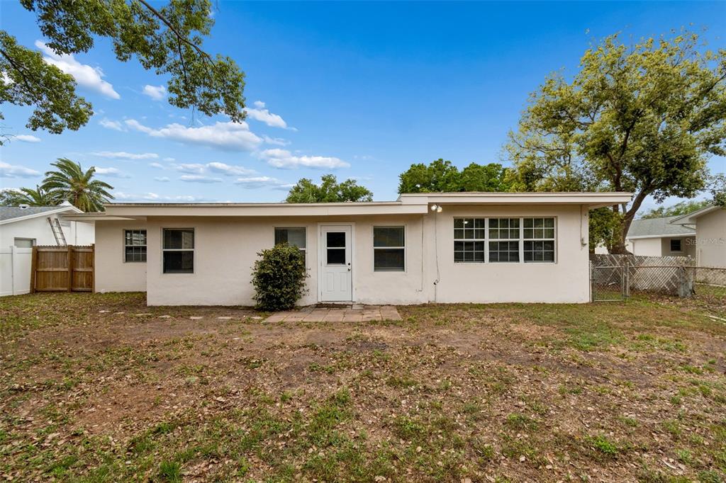 9931 110th Street Seminole, FL 33772 - Photo 42 of 52 a view of a house with a yard