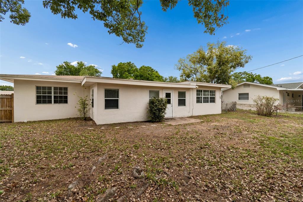 9931 110th Street Seminole, FL 33772 - Photo 44 of 52 front view of a house with a yard