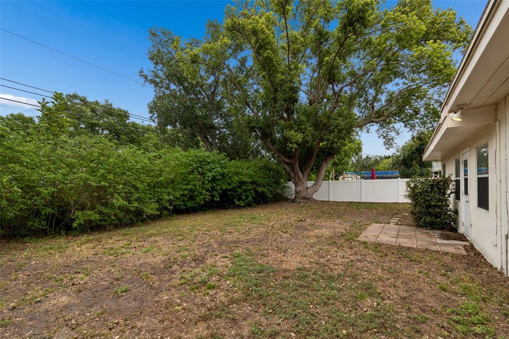 9931 110th Street Seminole, FL 33772 - Photo 45 of 52 a view of a house with a backyard