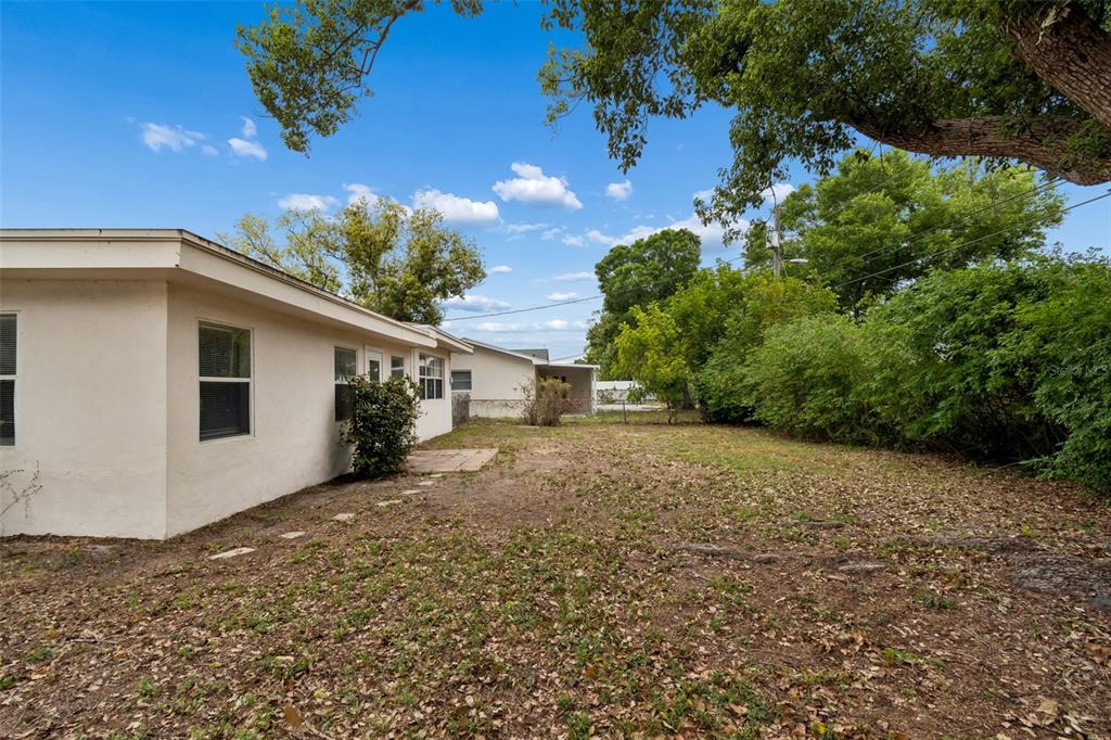 9931 110th Street Seminole, FL 33772 - Photo 46 of 52 a view of a house with a backyard
