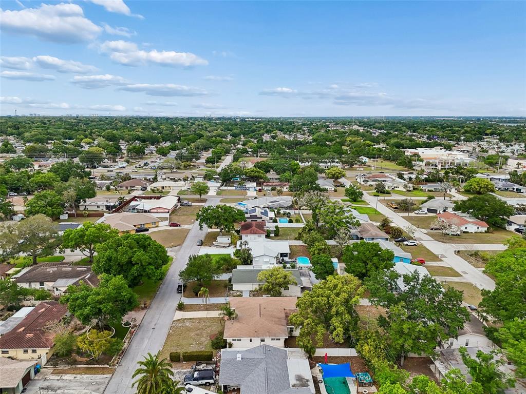 9931 110th Street Seminole, FL 33772 - Photo 52 of 52 an aerial view of residential houses with outdoor space