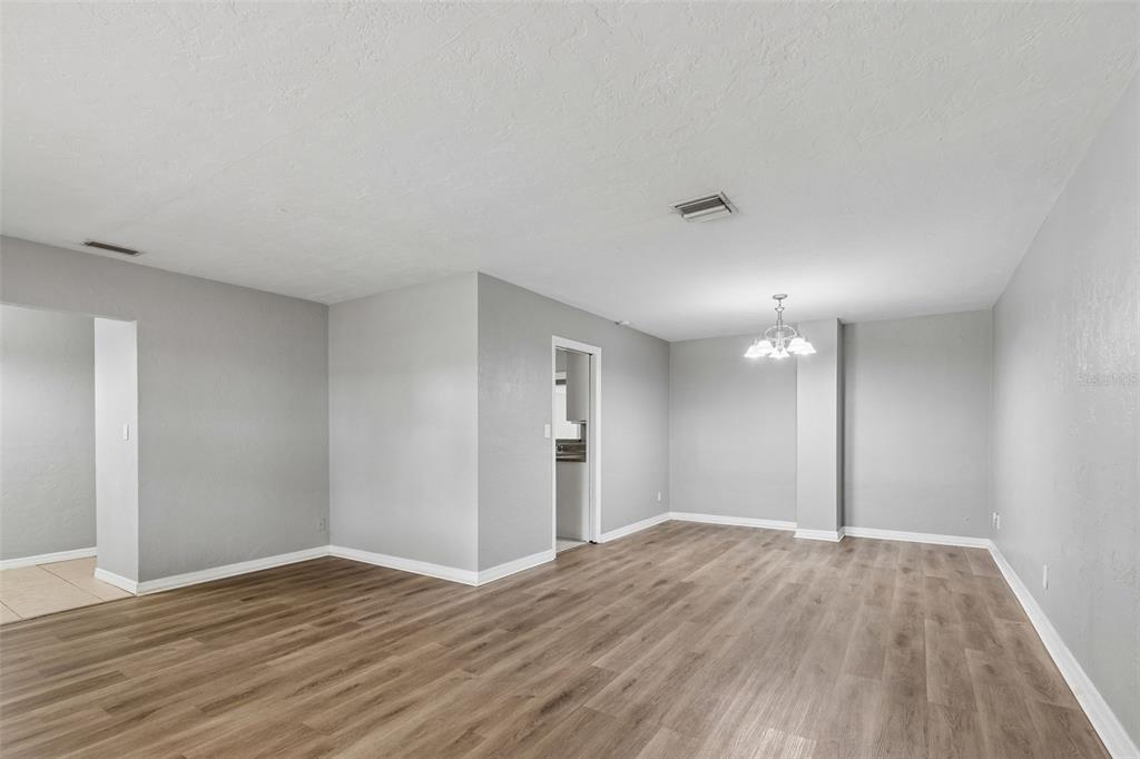 9931 110th Street Seminole, FL 33772 - Photo 10 of 52 a view of empty room with wooden floor