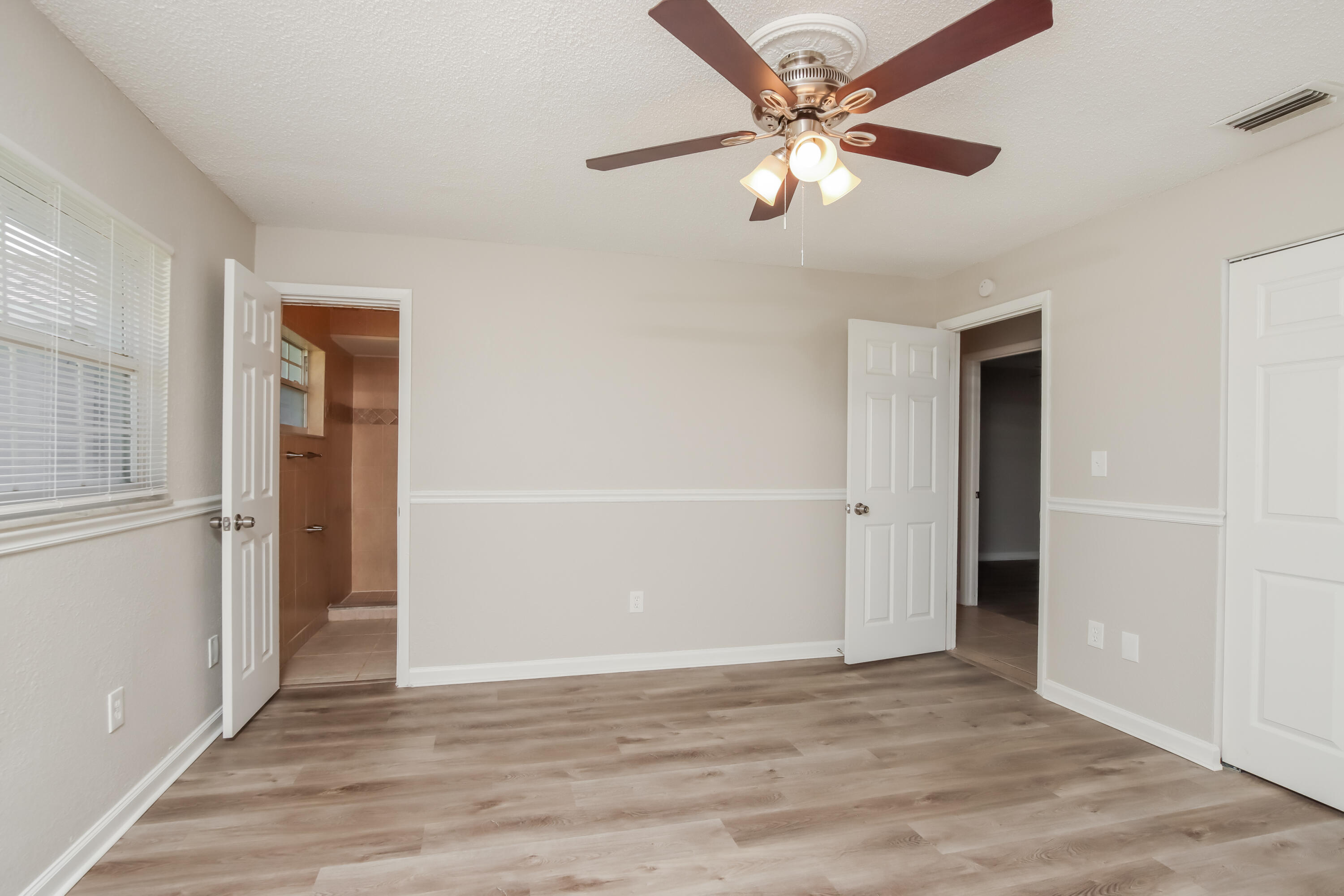1195 Cotton Road Northeast Palm Bay, FL 32905 - Photo 10 of 17 an empty room with fan and a ceiling fan
