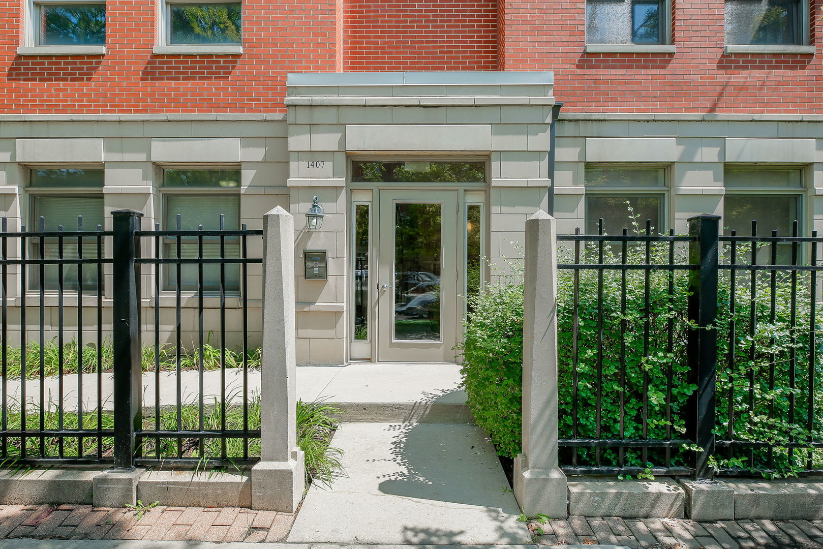 1407 South Halsted Street, Unit 1B Chicago, IL 60607 - Photo 1 of 1 front view of a brick building