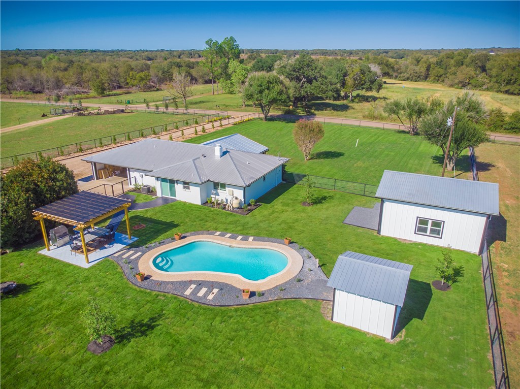 an aerial view of a house with garden space and outdoor space