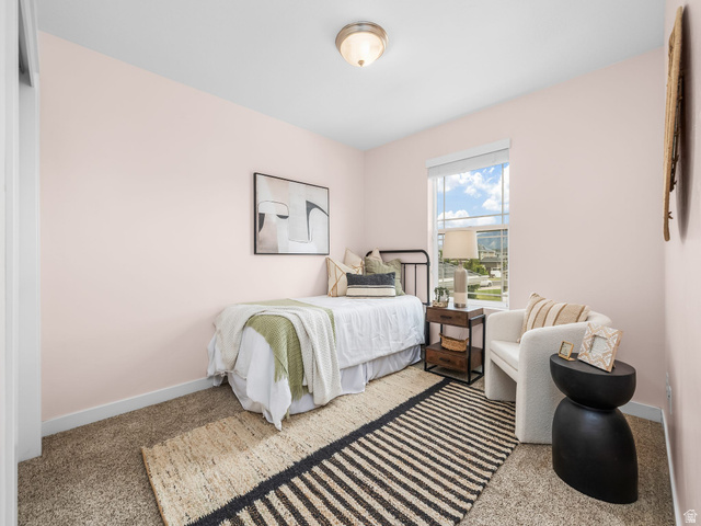 834 West 1050th Street South Springville, UT 84663 - Photo 18 of 26 Bedroom featuring light pink walls, carpet flooring, a window with exterior views, and a flush mount ceiling light