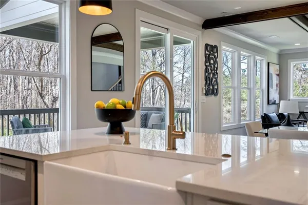 a bath tub sitting next to a bathroom sink