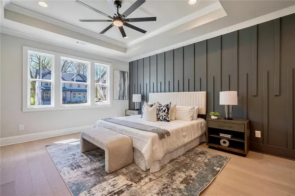 a bedroom with a large bed and a window