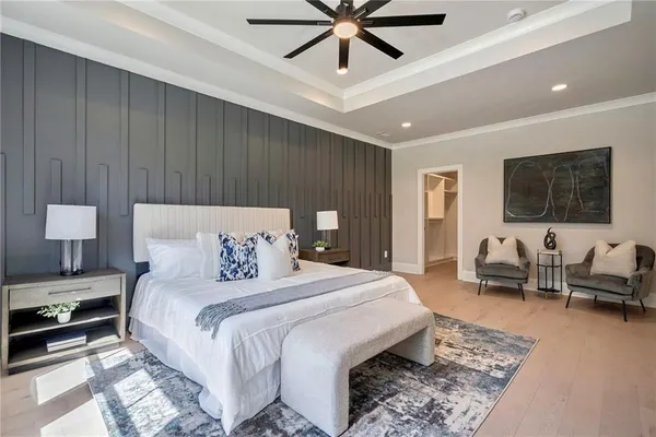 a bedroom with a bed couch and a window