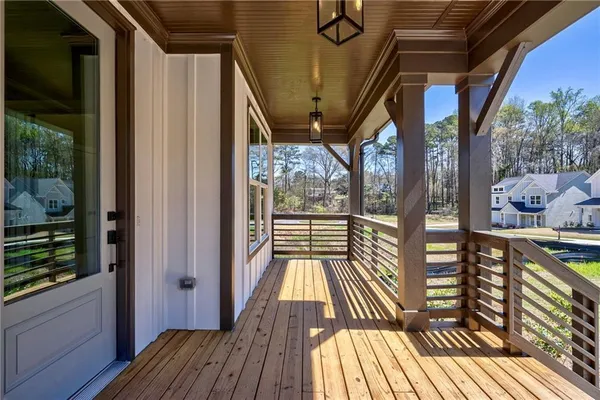a view of balcony with wooden floor