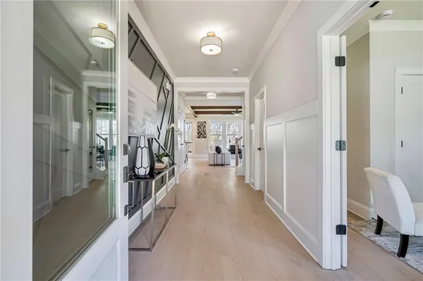 a hallway and a livingroom with furniture