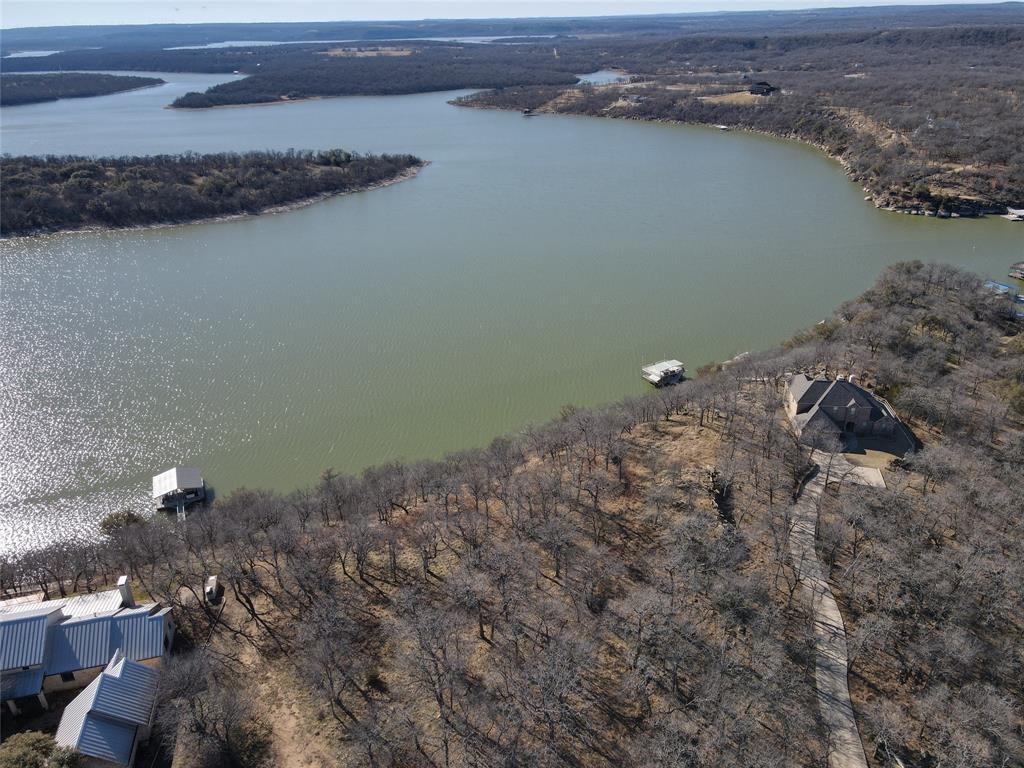 Tbd Ridgeline Drive Chico, TX 76431 - Photo 2 of 7 an aerial view of a houses with a lake view